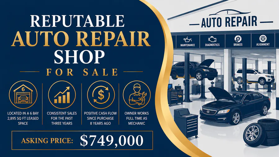 Auto repair shop with multiple service bays and vehicles being serviced, available for sale in Michigan.